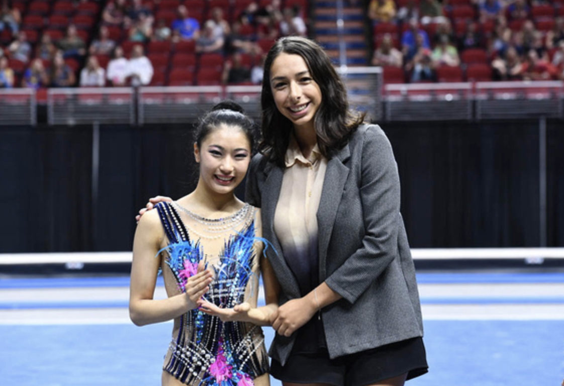 Elena Shinohara receives the Sportsperson of the Year Award from Rebecca Sereda (Credit: USA Gymnastics)